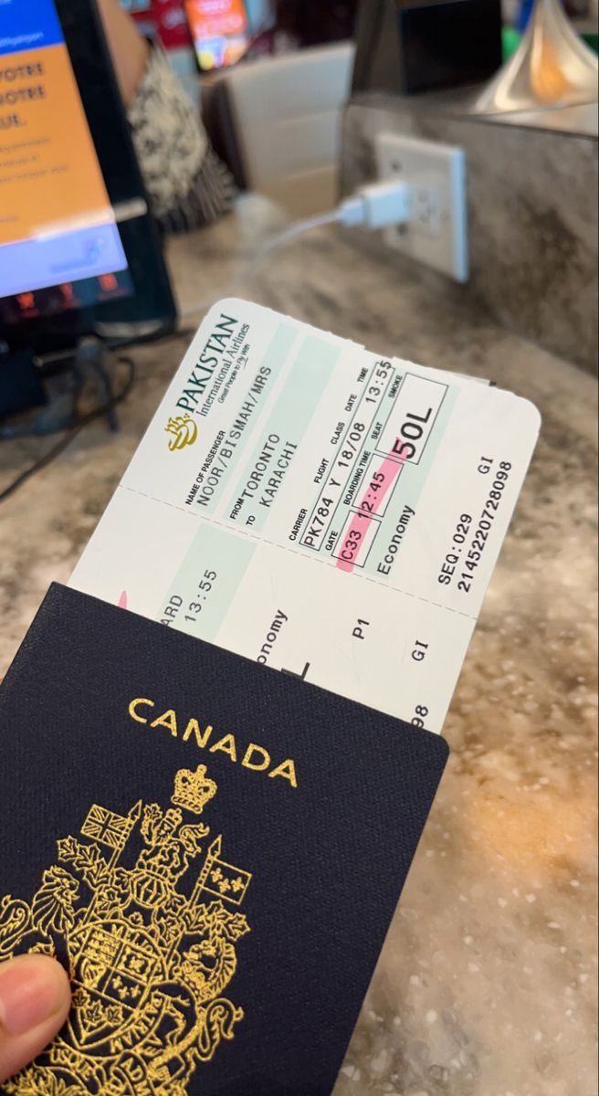 Canadian passport and travel papers pictured during a journey
